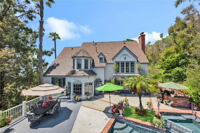 10302 Broadview Pl, North Tustin, CA 92705 - back of house with a balcony, a patio, stucco siding, french doors, and a chimney