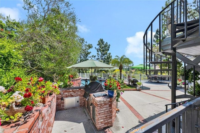 10302 Broadview Pl, North Tustin, CA 92705 - view of patio with an outdoor kitchen, fence, and stairway