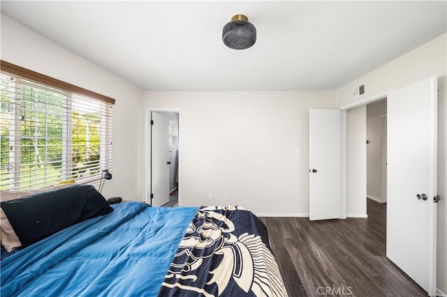 5222 Auburn Cir, Westminster, CA 92683 - bedroom featuring visible vents, baseboards, and wood finished floors