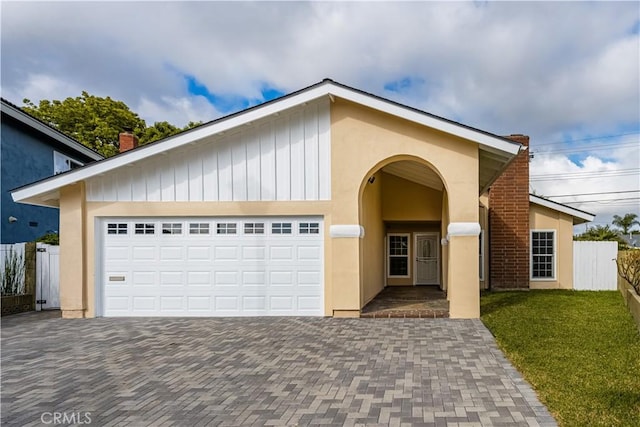 5222 Auburn Cir, Westminster, CA 92683 - view of front of house with fence, stucco siding, decorative driveway, and a front yard