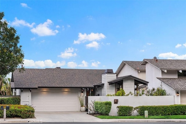 14 Woodsong Dr, Laguna Niguel, CA 92677 - view of front of home with a garage, driveway, and a shingled roof