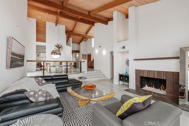 14 Woodsong Dr, Laguna Niguel, CA 92677 - living area with wood ceiling with exposed beams, a fireplace, and high vaulted ceiling
