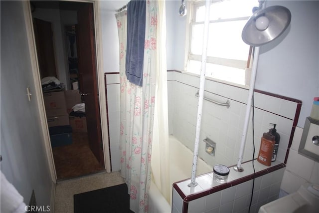 1211 Cole Ave, Los Angeles, CA 90038 - bathroom with shower / bath combo with shower curtain, tile walls, and a wainscoted wall