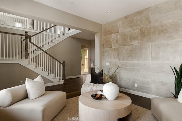 living room with baseboards, recessed lighting, wood finished floors, and stairway