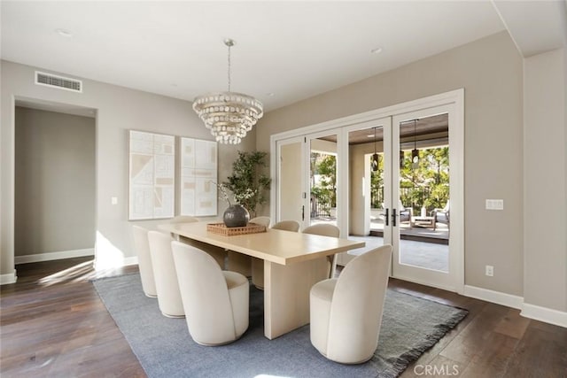 101 Via Artemesia, San Clemente, CA 92672 - dining space with french doors, dark wood-style flooring, and a chandelier