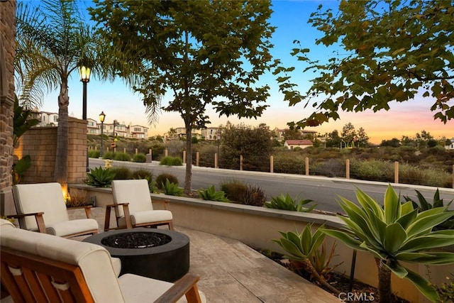 101 Via Artemesia, San Clemente, CA 92672 - patio terrace at dusk with an outdoor fire pit and a patio