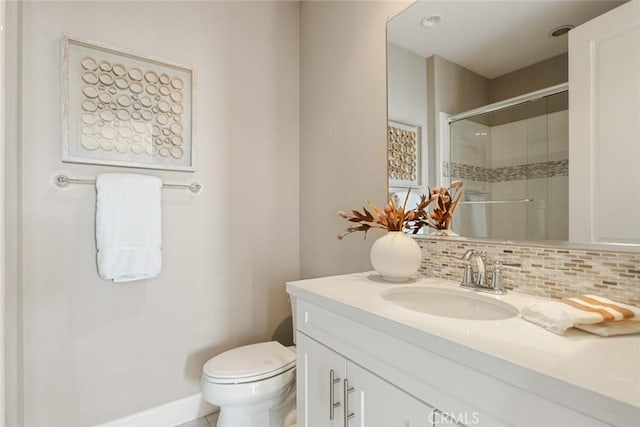 101 Via Artemesia, San Clemente, CA 92672 - bathroom featuring vanity, a tile shower, and decorative backsplash