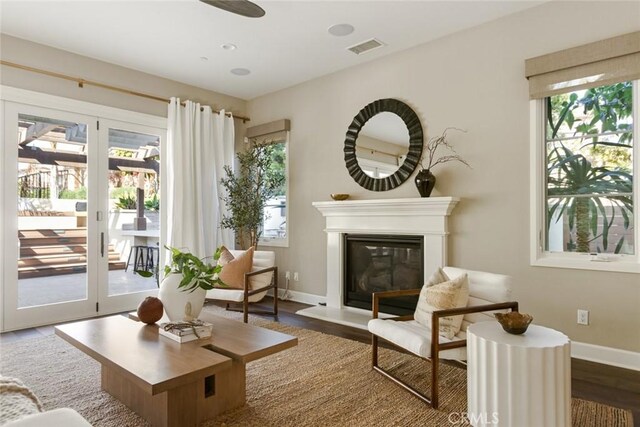 101 Via Artemesia, San Clemente, CA 92672 - sitting room with french doors, wood finished floors, and a glass covered fireplace