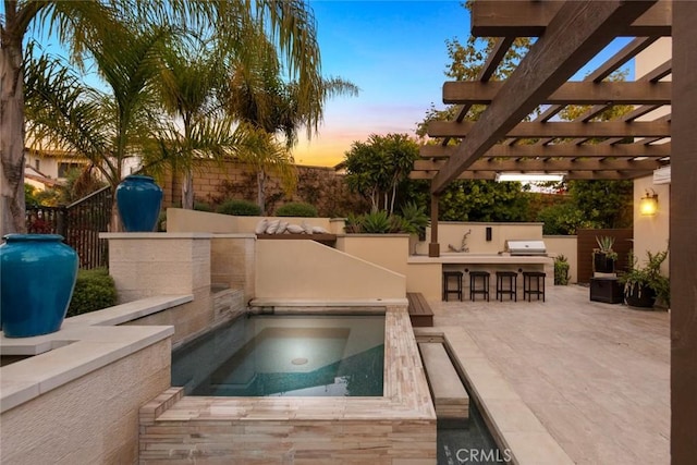 101 Via Artemesia, San Clemente, CA 92672 - pool at dusk featuring an outdoor bar, area for grilling, an in-ground hot tub, and a patio area