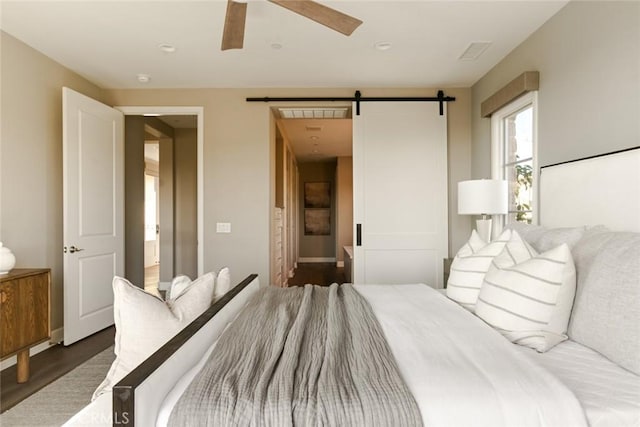 101 Via Artemesia, San Clemente, CA 92672 - bedroom with a barn door, wood finished floors, and a ceiling fan