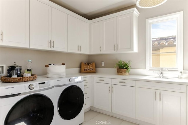 101 Via Artemesia, San Clemente, CA 92672 - laundry room featuring washer and clothes dryer, cabinet space, plenty of natural light, and light tile patterned flooring