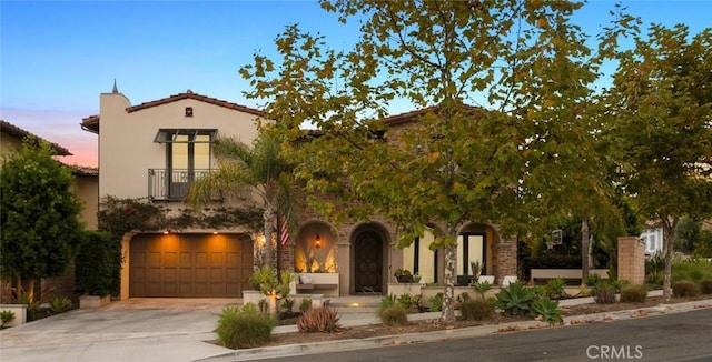 101 Via Artemesia, San Clemente, CA 92672 - view of front of home with driveway, a balcony, an attached garage, and stucco siding