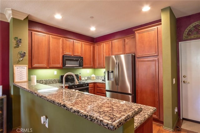 28365 Socorro St Unit 45, Murrieta, CA 92563 - kitchen with black microwave, stainless steel refrigerator with ice dispenser, range with gas cooktop, a peninsula, and recessed lighting