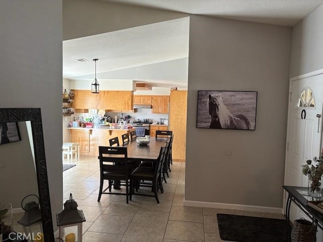 1331 Alicante, Madera, CA 93638 - dining area with lofted ceiling, light tile patterned floors, and baseboards