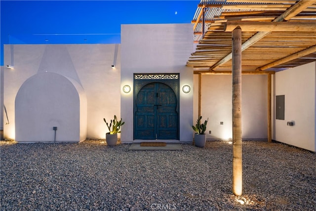 63973 Gold Nugget Rd, Joshua Tree, CA 92252 - entrance to property featuring electric panel and stucco siding