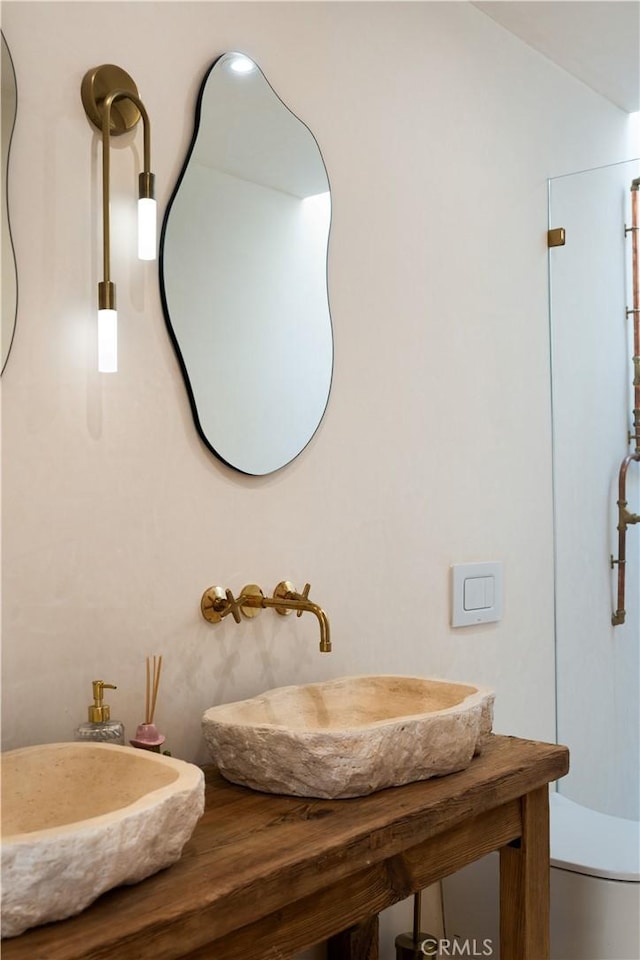63973 Gold Nugget Rd, Joshua Tree, CA 92252 - bathroom featuring a sink and wood finished floors