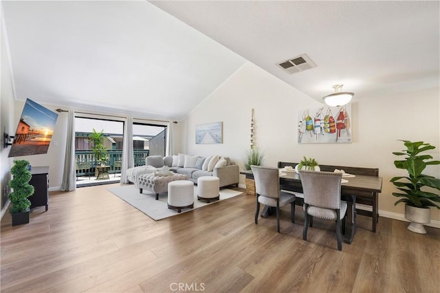 12812 Timber Rd Unit 22, Garden Grove, CA 92840 - dining space with wood finished floors and vaulted ceiling
