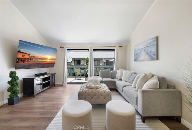 12812 Timber Rd Unit 22, Garden Grove, CA 92840 - living area with lofted ceiling, wood finished floors, crown molding, and baseboards