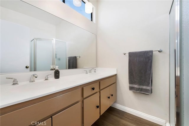 12812 Timber Rd Unit 22, Garden Grove, CA 92840 - full bath with double vanity, wood finished floors, baseboards, and a shower stall