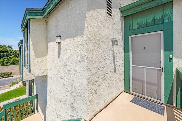 12812 Timber Rd Unit 22, Garden Grove, CA 92840 - view of exterior entry with stucco siding