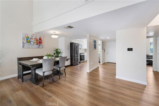 12812 Timber Rd Unit 22, Garden Grove, CA 92840 - dining space featuring light wood-style floors