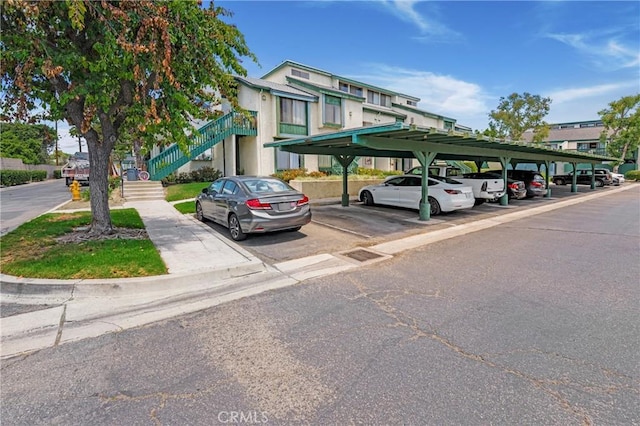 12812 Timber Rd Unit 22, Garden Grove, CA 92840 - covered parking lot featuring stairs
