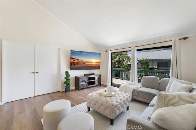 12812 Timber Rd Unit 22, Garden Grove, CA 92840 - living area with wood finished floors and high vaulted ceiling