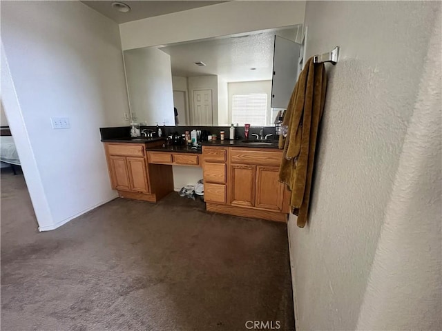 938 Sparrow Way, Perris, CA 92571 - bathroom with connected bathroom, double vanity, a textured wall, and a sink