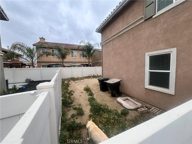 938 Sparrow Way, Perris, CA 92571 - view of side of property featuring fence and stucco siding