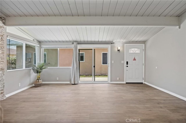 interior space featuring beam ceiling