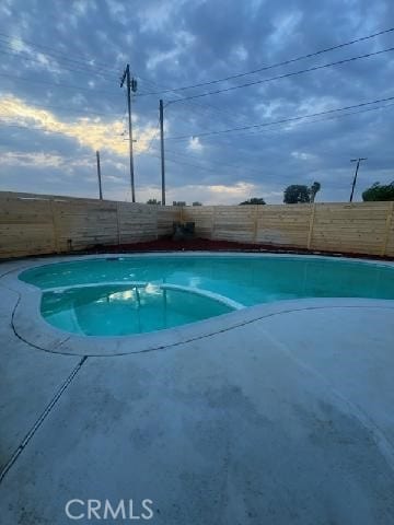view of swimming pool featuring a fenced in pool and a fenced backyard