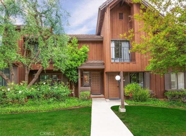 1503 Westmont Dr, San Pedro, CA 90732 - view of front of house with a front yard and a balcony