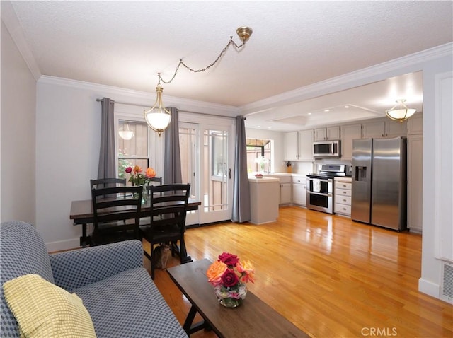 1503 Westmont Dr, San Pedro, CA 90732 - living room featuring light wood finished floors, ornamental molding, a textured ceiling, and baseboards