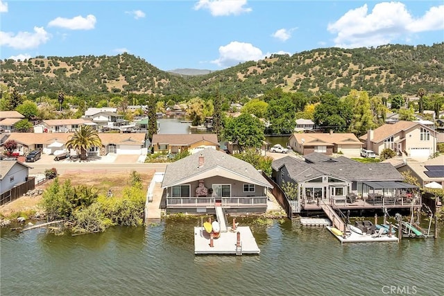 aerial view featuring a residential view and a water and mountain view