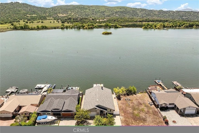 bird's eye view with a residential view and a water and mountain view