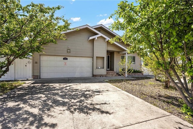 view of front of home featuring an attached garage and driveway