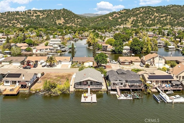 bird's eye view with a residential view and a water and mountain view