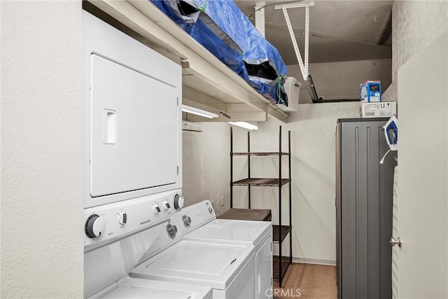laundry area with laundry area and stacked washer and dryer