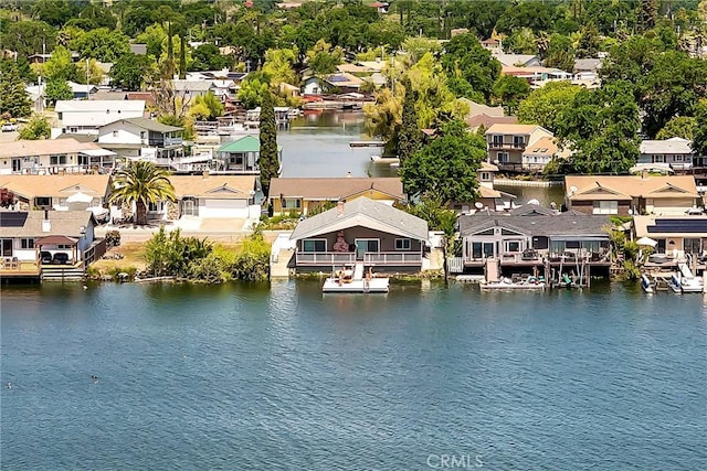 birds eye view of property with a residential view and a water view