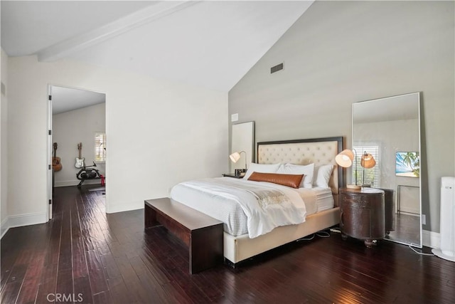 bedroom with visible vents, multiple windows, and hardwood / wood-style floors