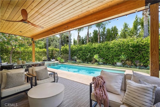 view of swimming pool with a pool with connected hot tub, an outdoor living space, and a ceiling fan