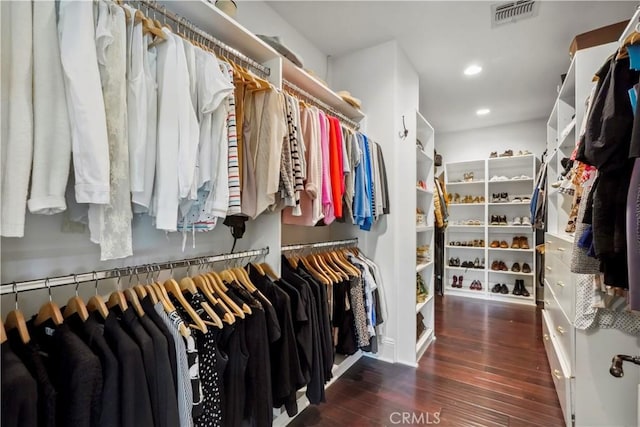 walk in closet featuring visible vents and wood finished floors