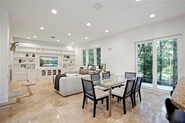 dining area featuring recessed lighting, built in features, and visible vents
