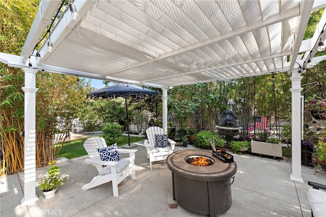 view of patio featuring a pergola and an outdoor fire pit