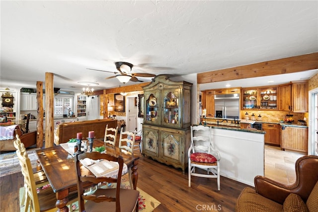 dining room with ceiling fan and light wood-type flooring