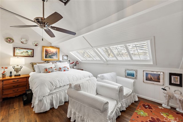 bedroom with a ceiling fan, baseboards, lofted ceiling, and wood-type flooring
