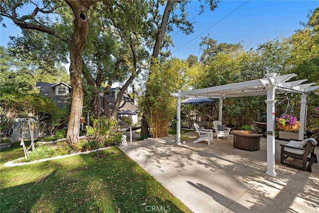 view of patio with an outdoor fire pit and a pergola