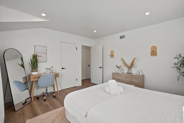 bedroom featuring recessed lighting, visible vents, and wood finished floors