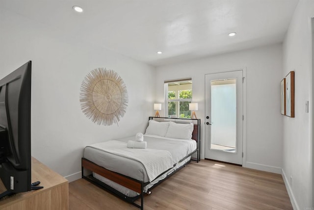 bedroom featuring recessed lighting, baseboards, and wood finished floors