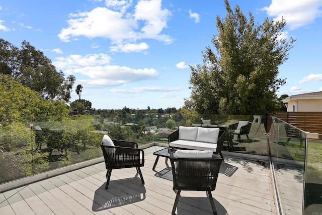 wooden terrace featuring an outdoor hangout area